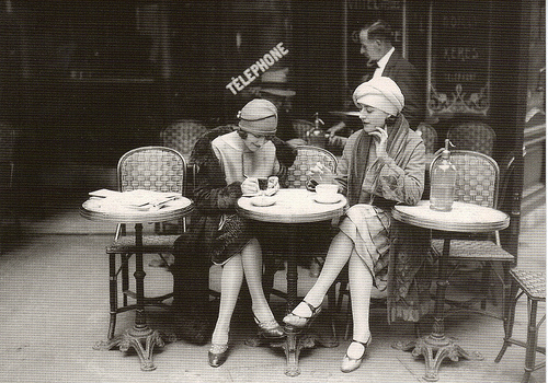 Women on a French cafe terrace writing circa 1925
